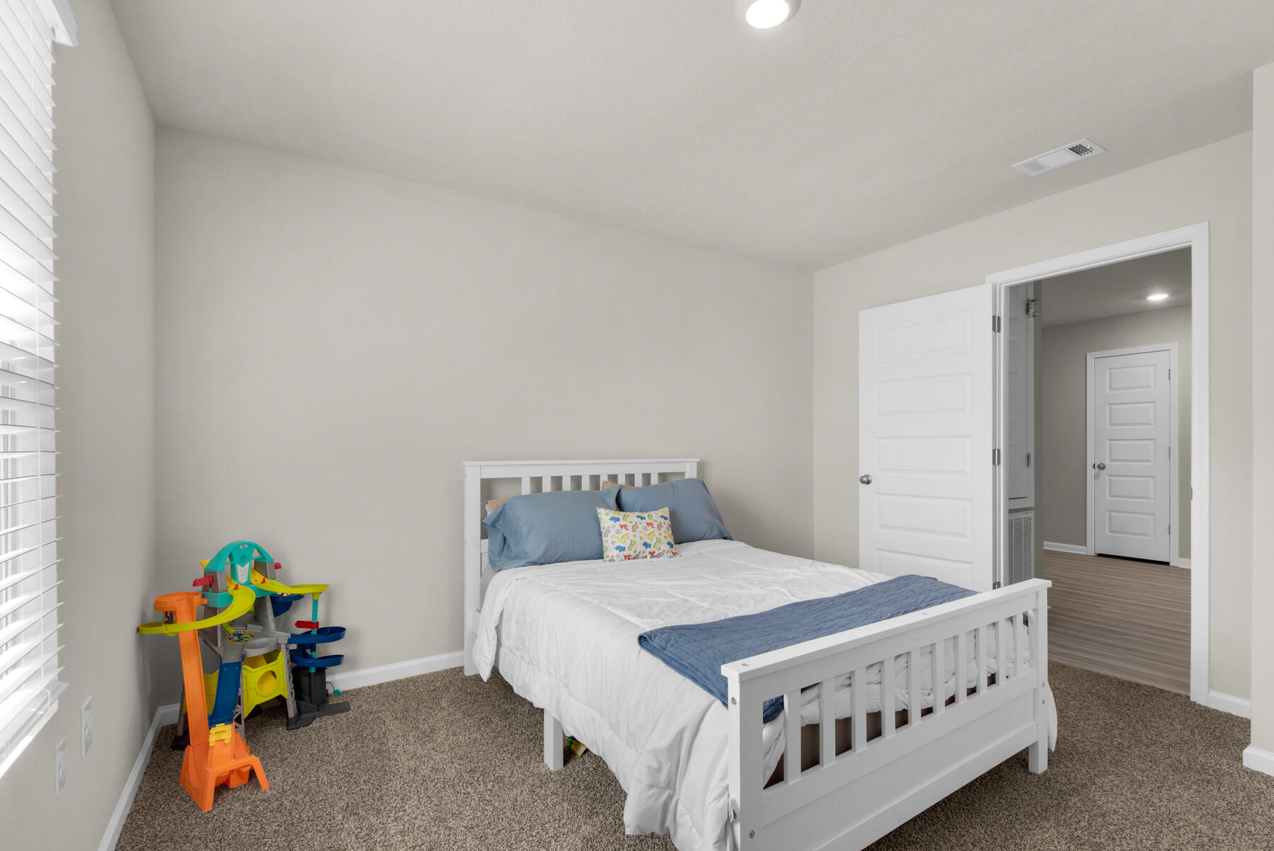 924 Sandbar Loop Crestview, FL 32539 - Photo 16 of 25 a bedroom with a bed and a window