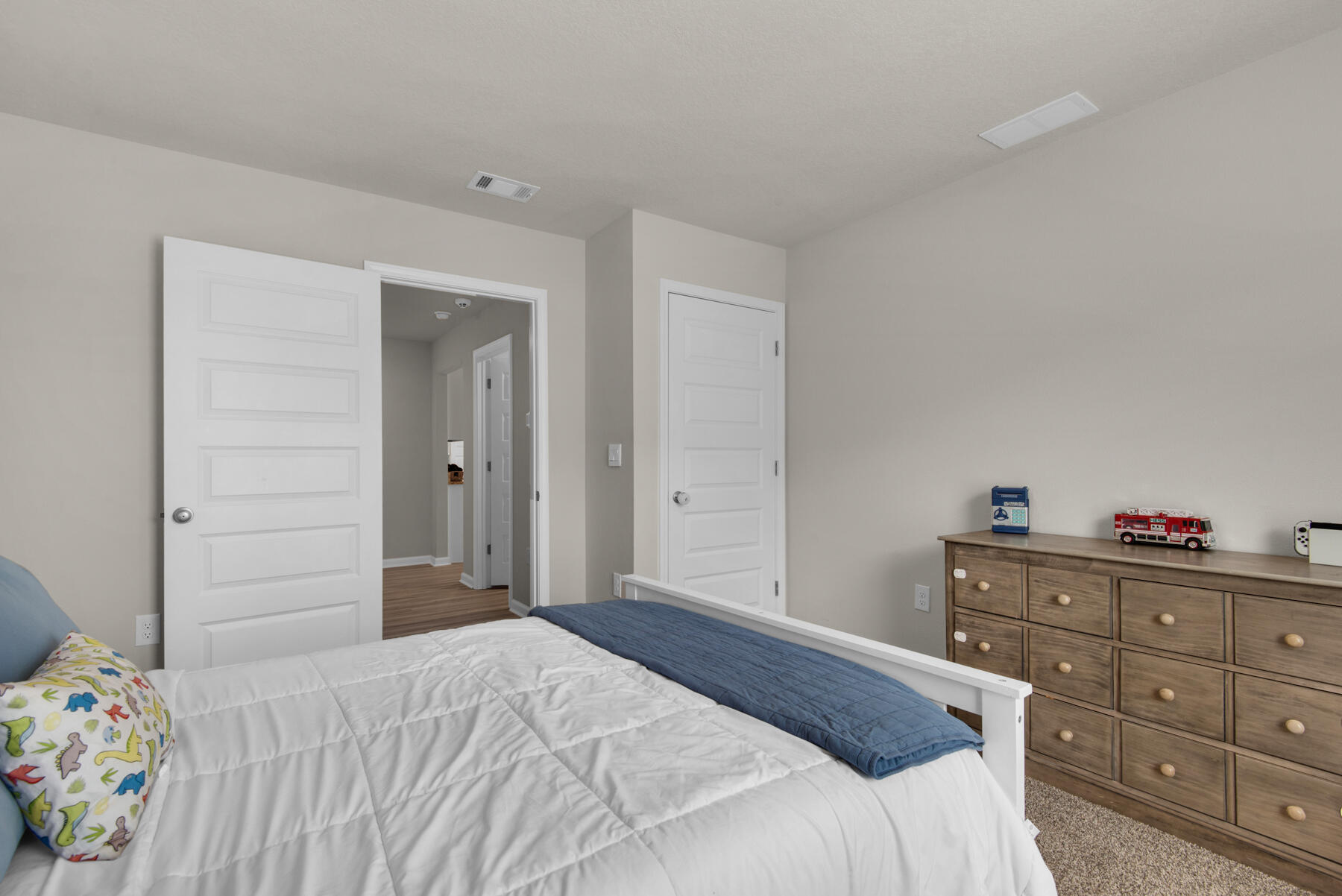 924 Sandbar Loop Crestview, FL 32539 - Photo 17 of 25 a bedroom with a bed and hallway