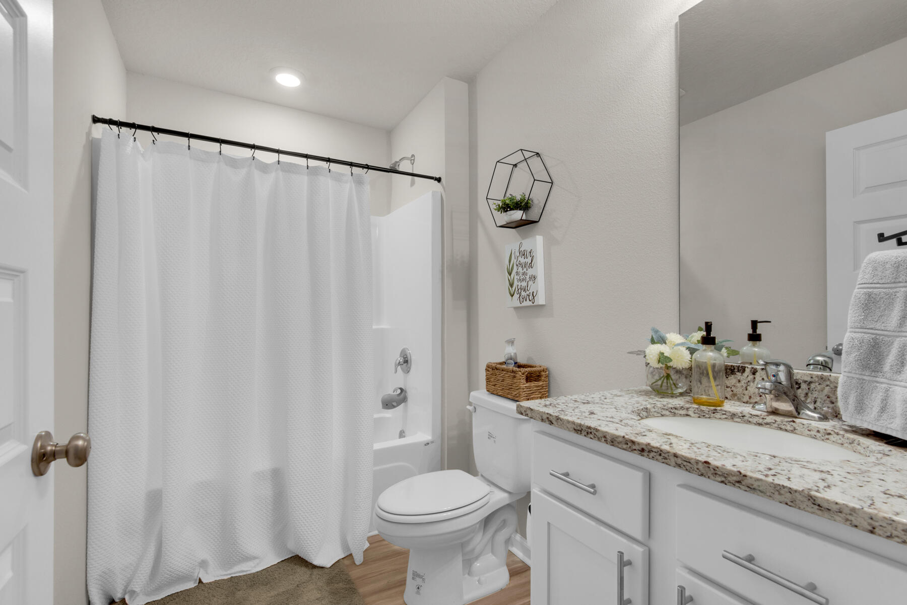 924 Sandbar Loop Crestview, FL 32539 - Photo 18 of 25 a bathroom with a granite countertop sink toilet and shower