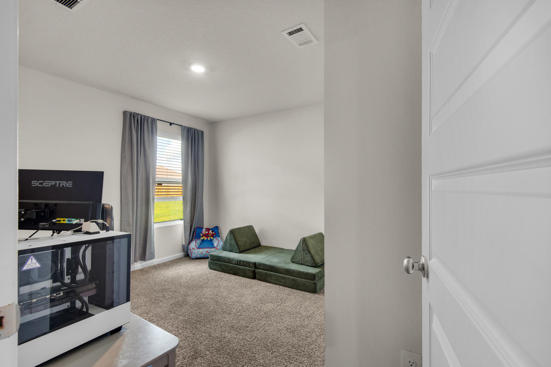 924 Sandbar Loop Crestview, FL 32539 - Photo 19 of 25 a living room with furniture and a flat screen tv
