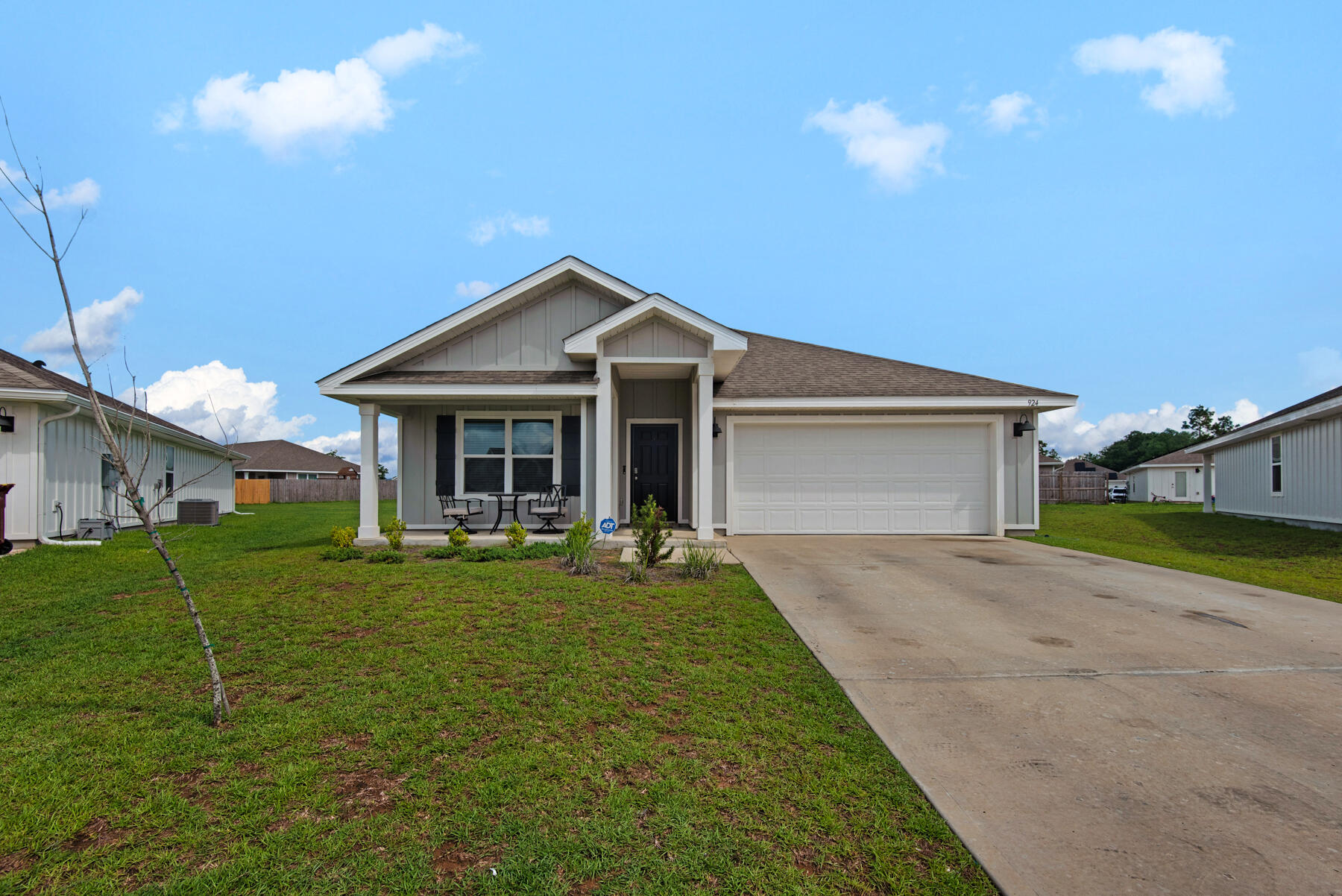 924 Sandbar Loop Crestview, FL 32539 - Photo 2 of 25 a front view of a house with a yard and porch