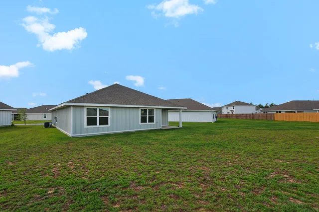 a view of a field with an ocean view