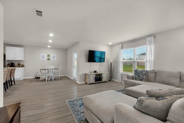 a living room with furniture or couch and a flat screen tv