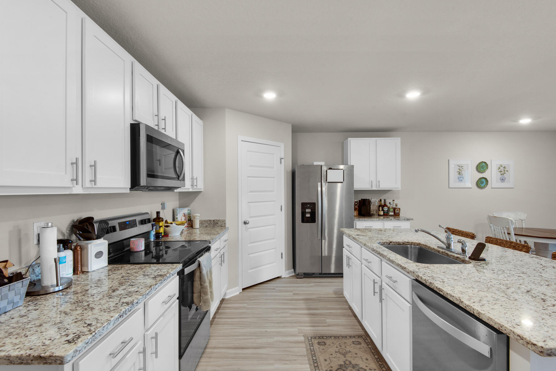 924 Sandbar Loop Crestview, FL 32539 - Photo 10 of 25 a kitchen with stainless steel appliances granite countertop a sink stove and refrigerator