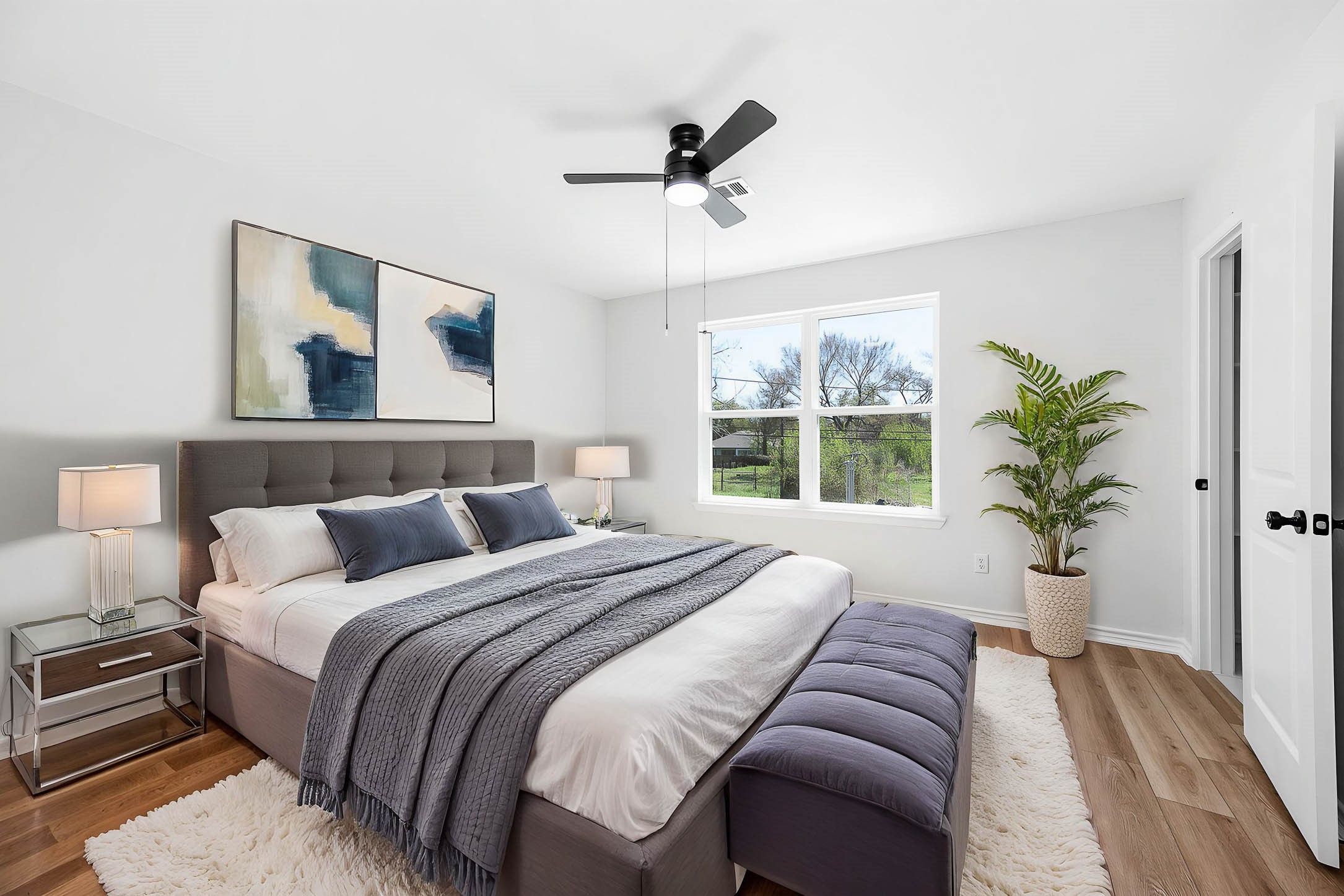 2022 Hampton Street, Unit A B Houston, TX 77088 - Photo 16 of 31 a bedroom with a large bed and a window