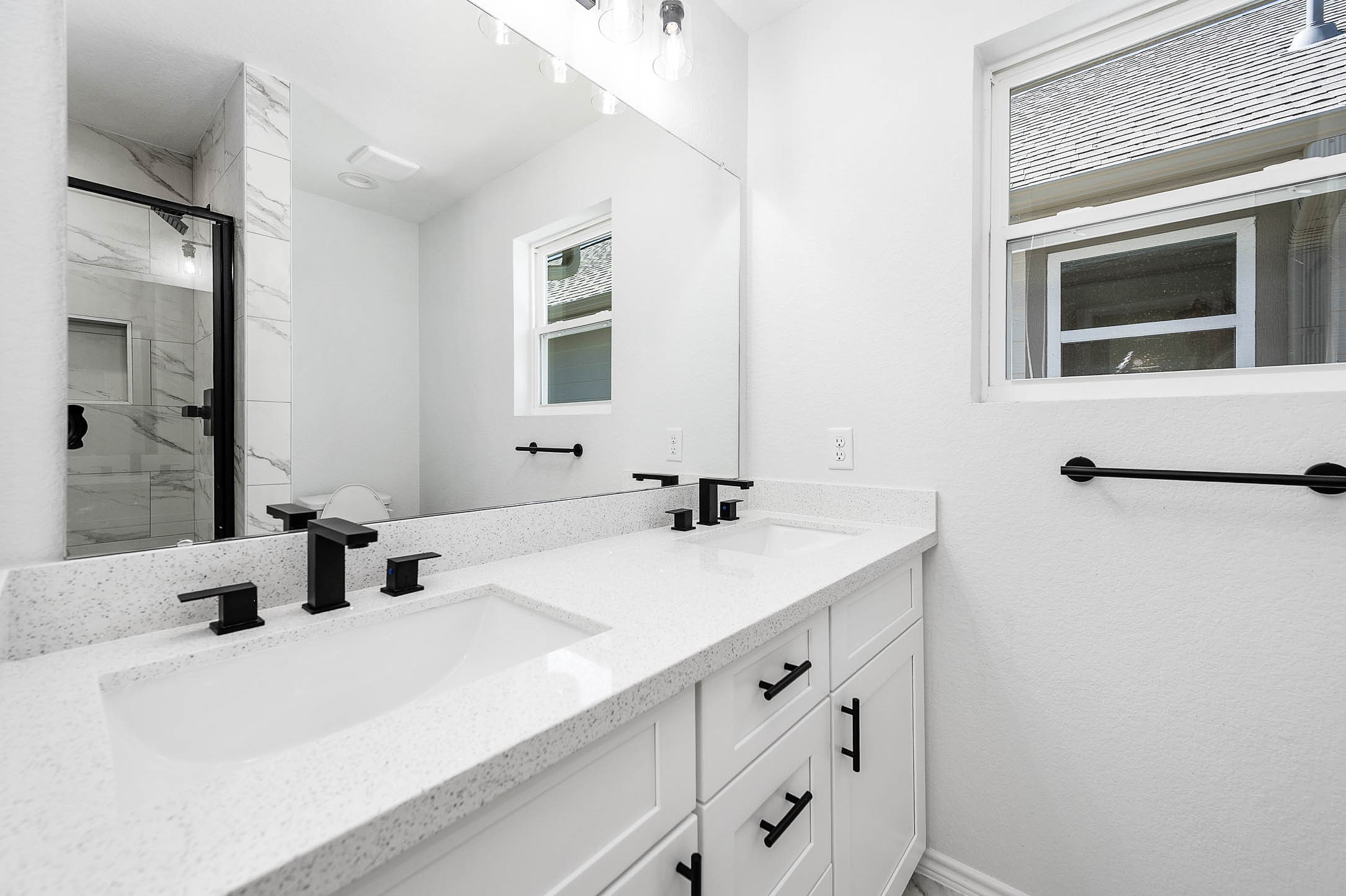 2022 Hampton Street, Unit A B Houston, TX 77088 - Photo 20 of 31 a bathroom with a sink and a mirror
