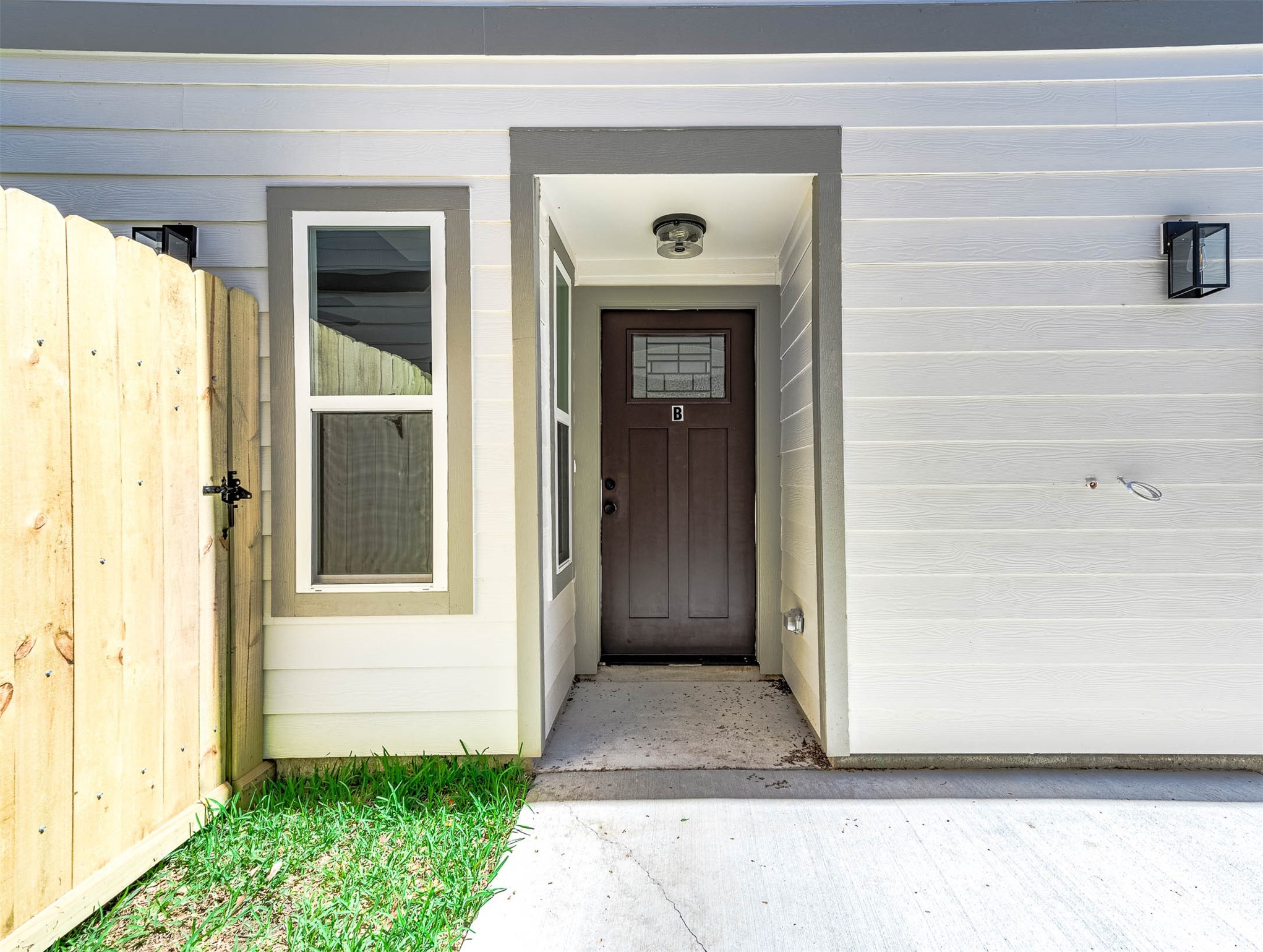 2022 Hampton Street, Unit A B Houston, TX 77088 - Photo 31 of 31 a front view of a house with a yard