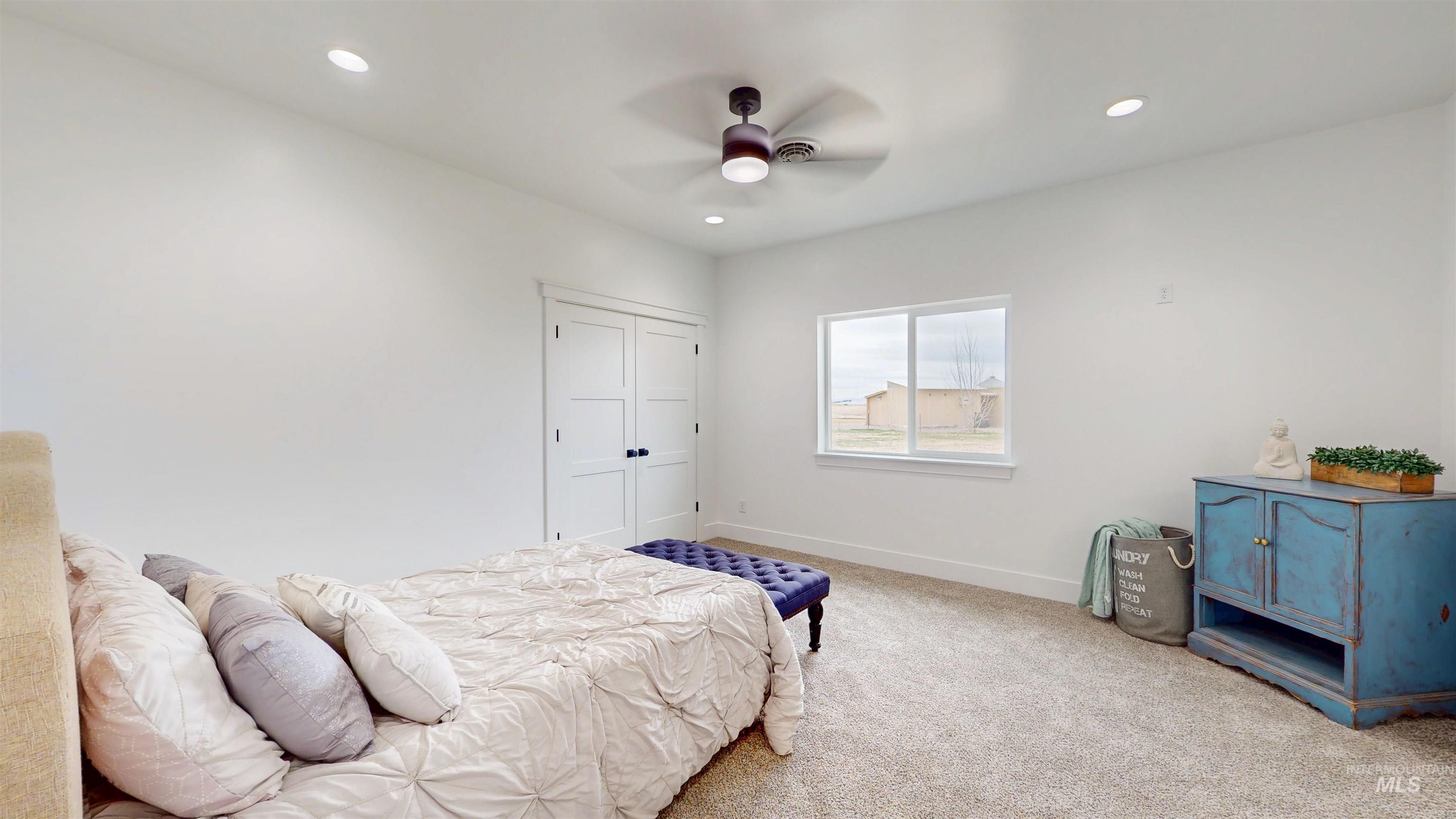 304 Shillington Court Rupert, ID 83350 - Photo 23 of 40 Bedroom featuring carpet flooring, a closet, ceiling fan, and recessed lighting
