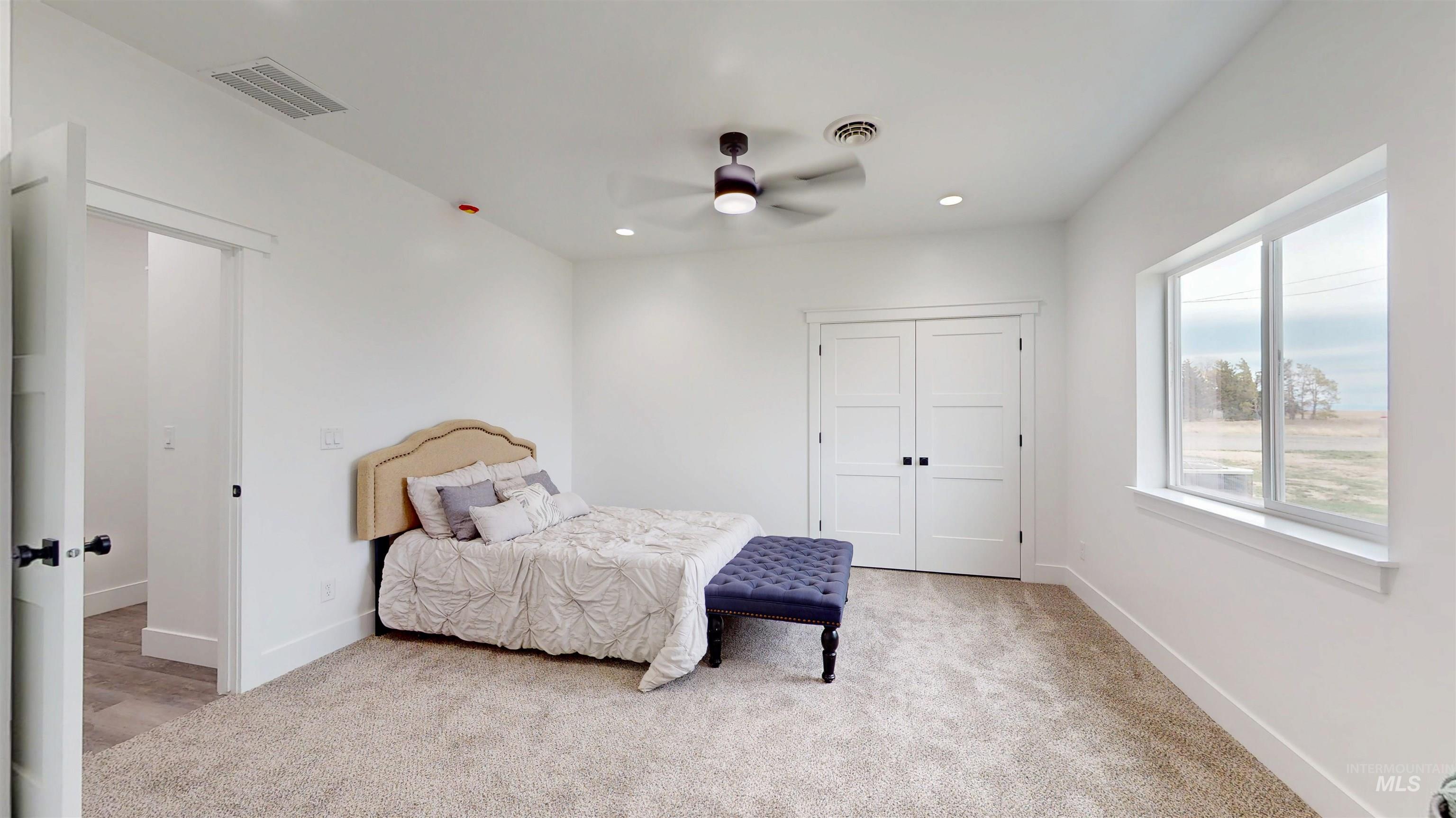 304 Shillington Court Rupert, ID 83350 - Photo 24 of 40 Bedroom featuring light carpet, ceiling fan, recessed lighting, and a closet
