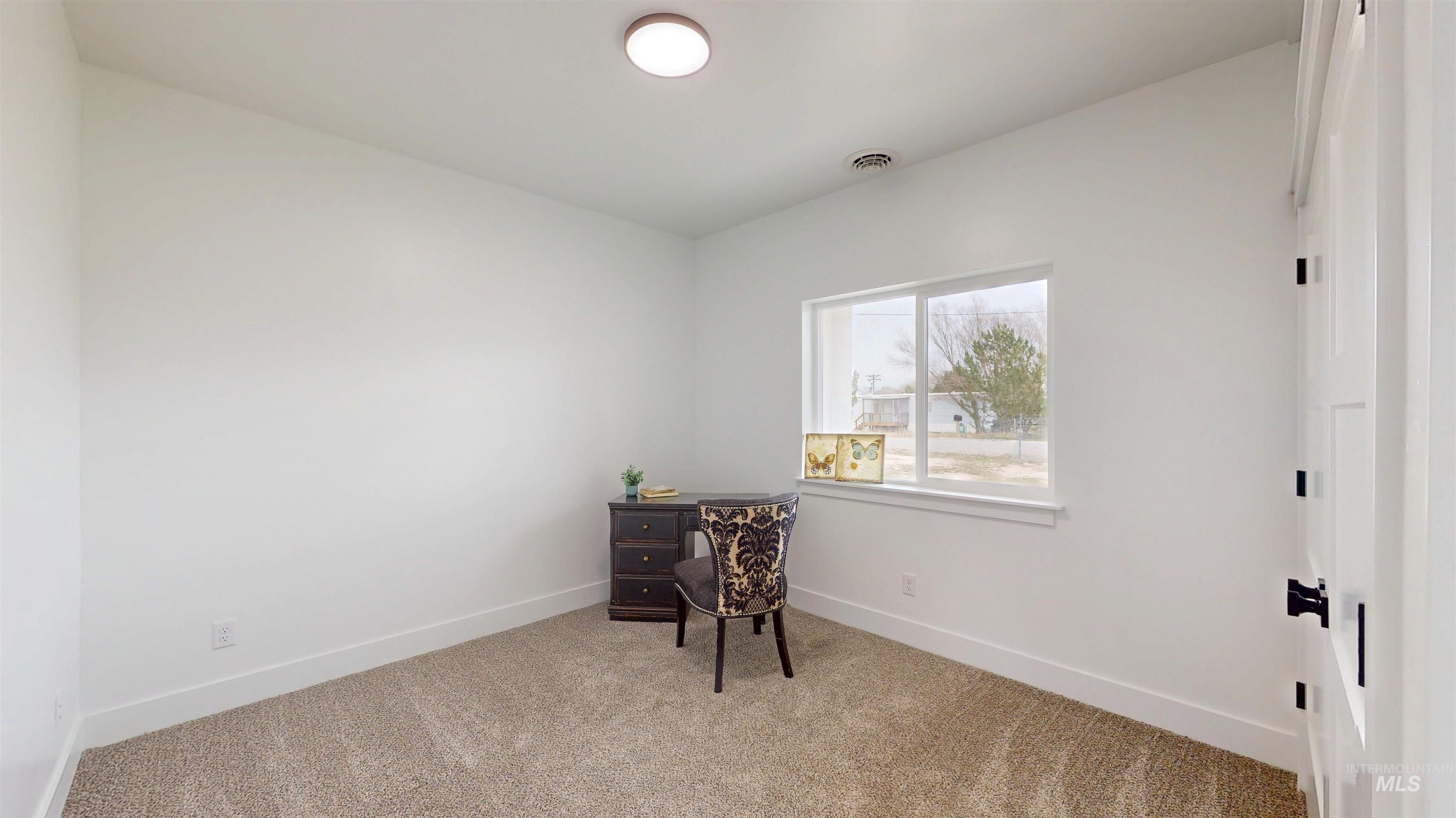 304 Shillington Court Rupert, ID 83350 - Photo 30 of 40 Bedroom with light carpet and baseboards