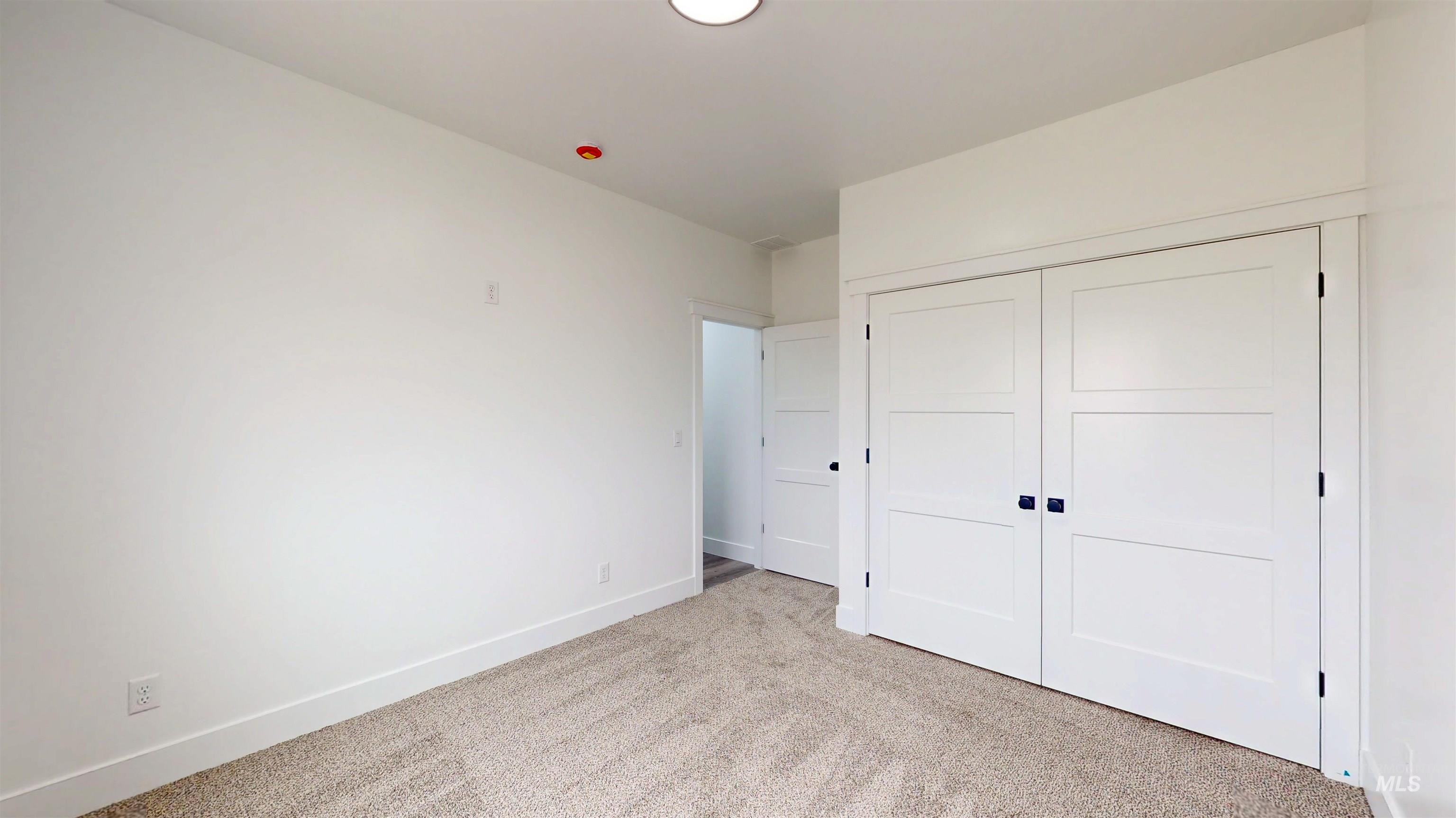 304 Shillington Court Rupert, ID 83350 - Photo 35 of 40 Unfurnished bedroom featuring light colored carpet and a closet