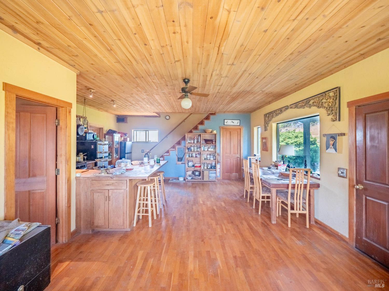 19780 Yorkville Ranch Road Yorkville, CA 95494 - Photo 22 of 49 a dining room with furniture and wooden floor
