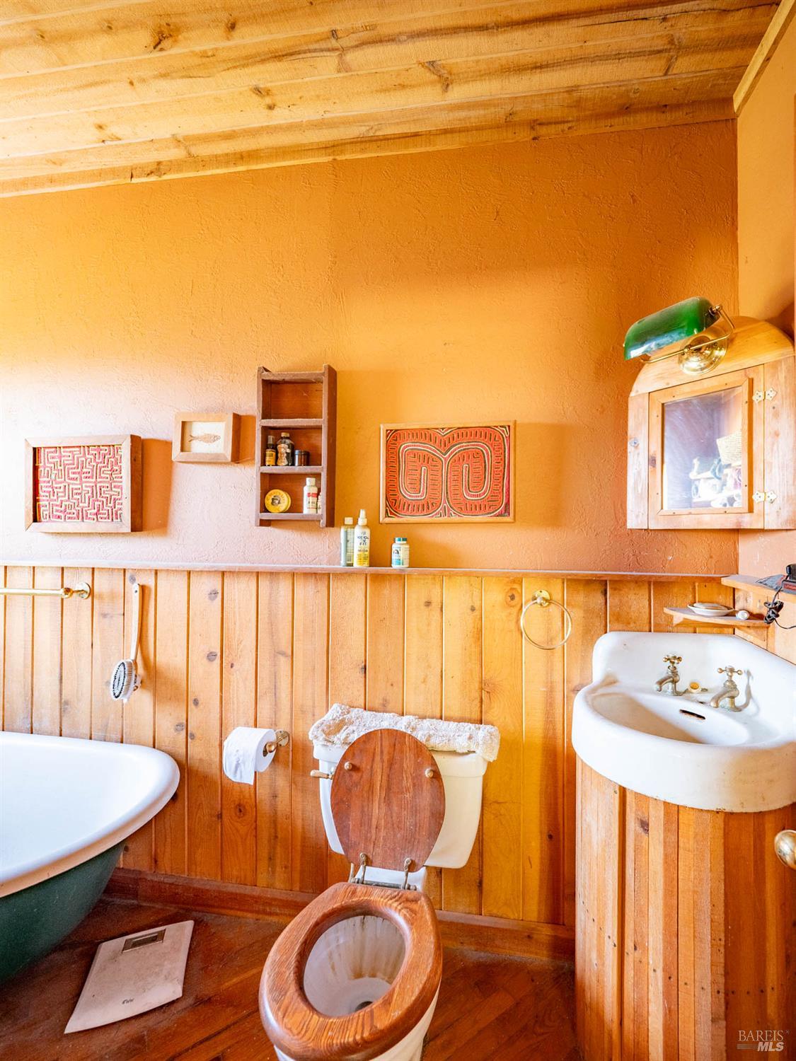 19780 Yorkville Ranch Road Yorkville, CA 95494 - Photo 27 of 49 a bathroom with a sink mirror vanity and toilet