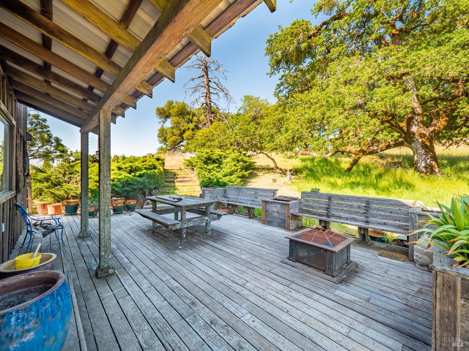 19780 Yorkville Ranch Road Yorkville, CA 95494 - Photo 31 of 49 a view of a roof deck with couches and wooden floor