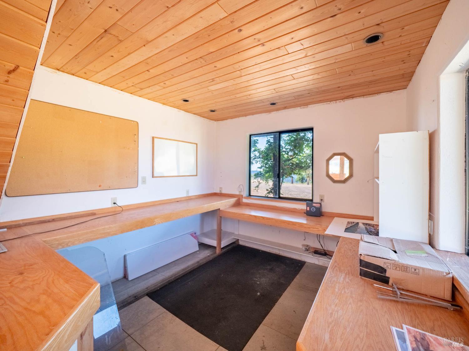 19780 Yorkville Ranch Road Yorkville, CA 95494 - Photo 42 of 49 a large white kitchen with a large window and stainless steel appliances