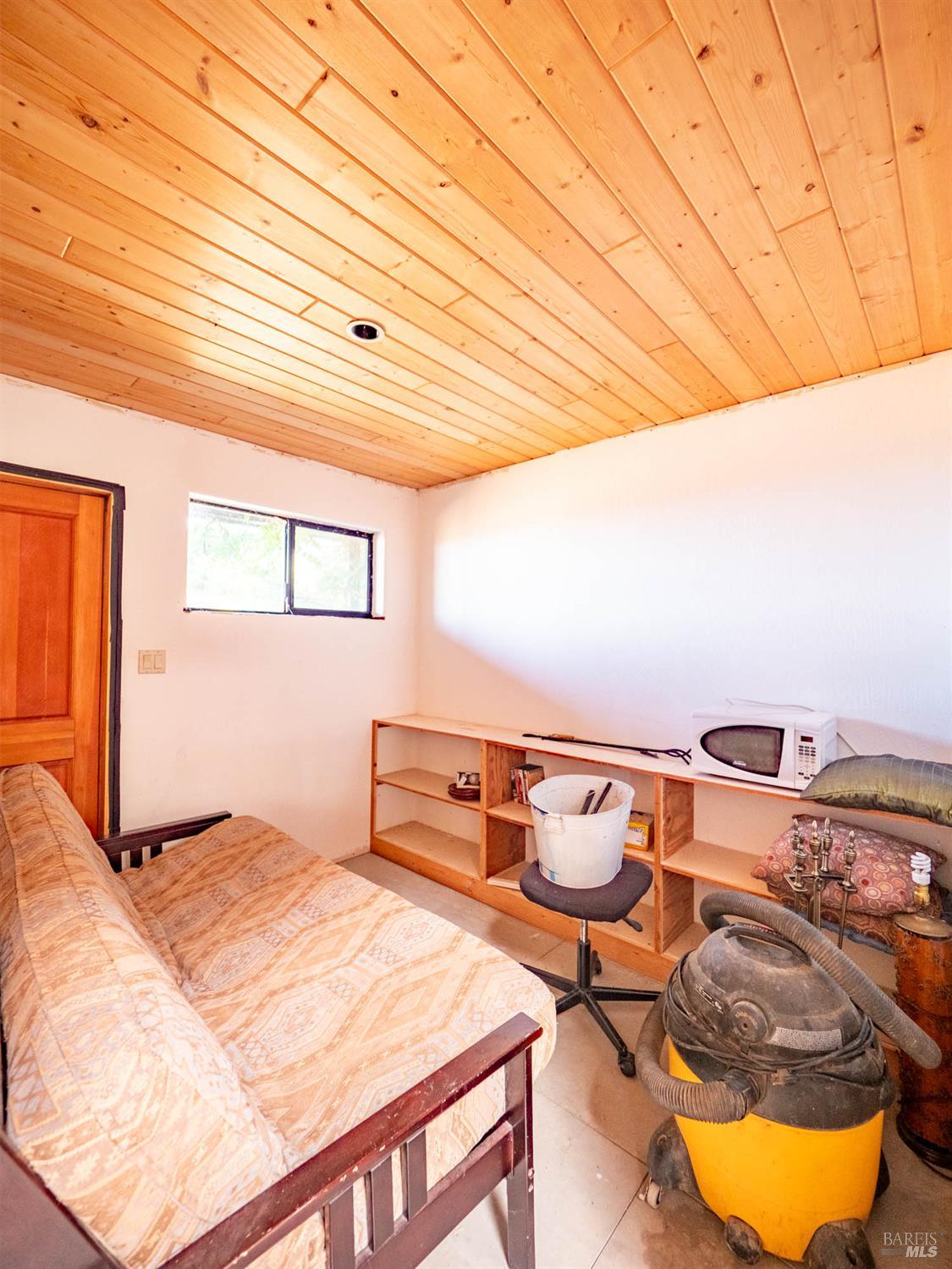 19780 Yorkville Ranch Road Yorkville, CA 95494 - Photo 46 of 49 a bedroom with a bed and window