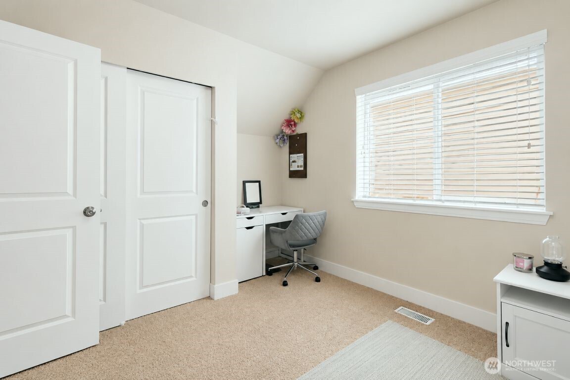 19607 25th Drive Southeast Bothell, WA 98012 - Photo 26 of 30 a room that has a dresser and a chair in it
