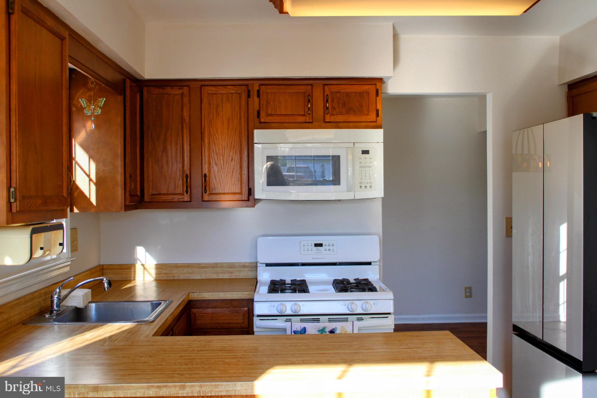 13 Langley Drive Sewell, NJ 08080 - Photo 11 of 31 a kitchen with a refrigerator and a sink