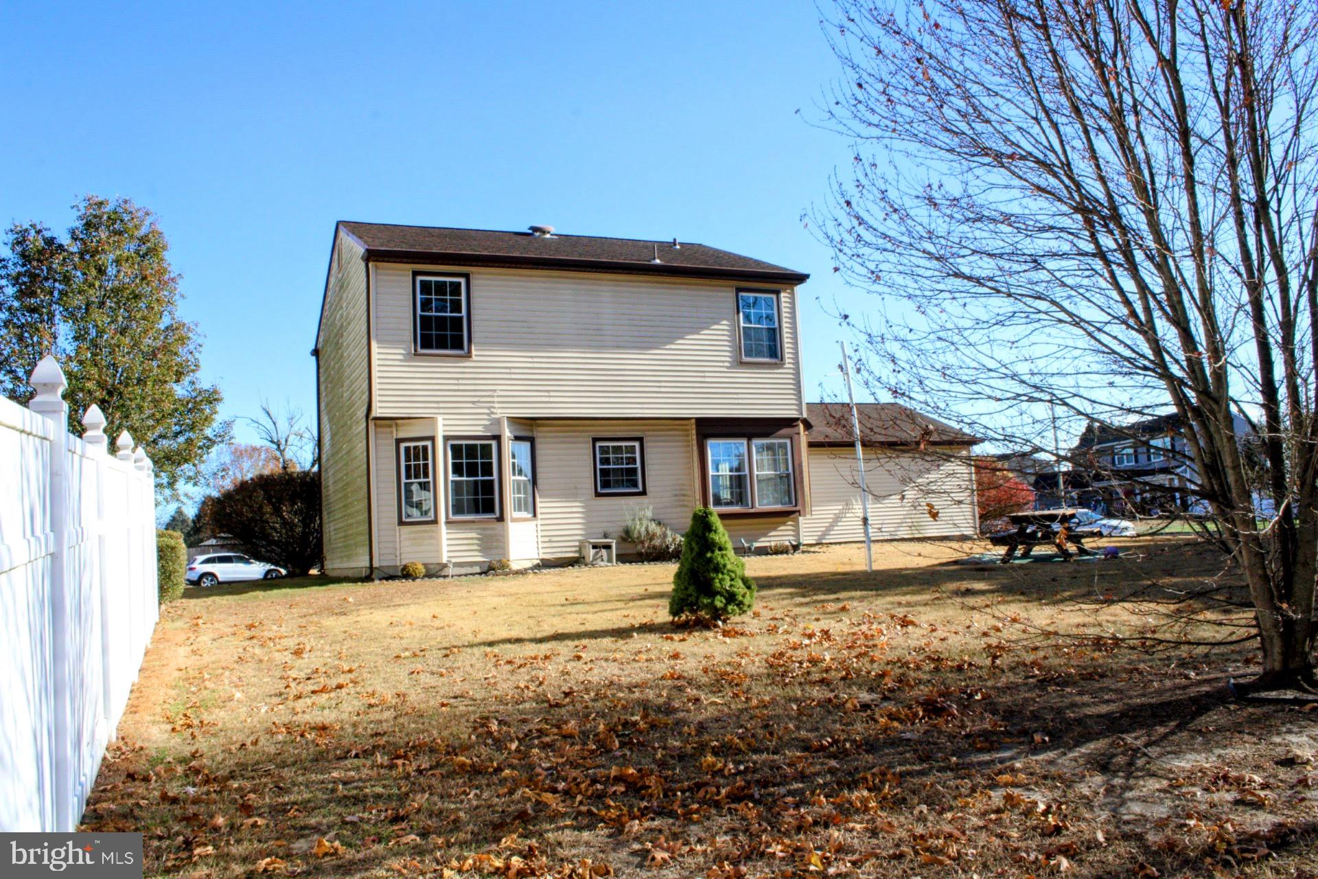 13 Langley Drive Sewell, NJ 08080 - Photo 3 of 31 a view of a house with a yard covered in snow