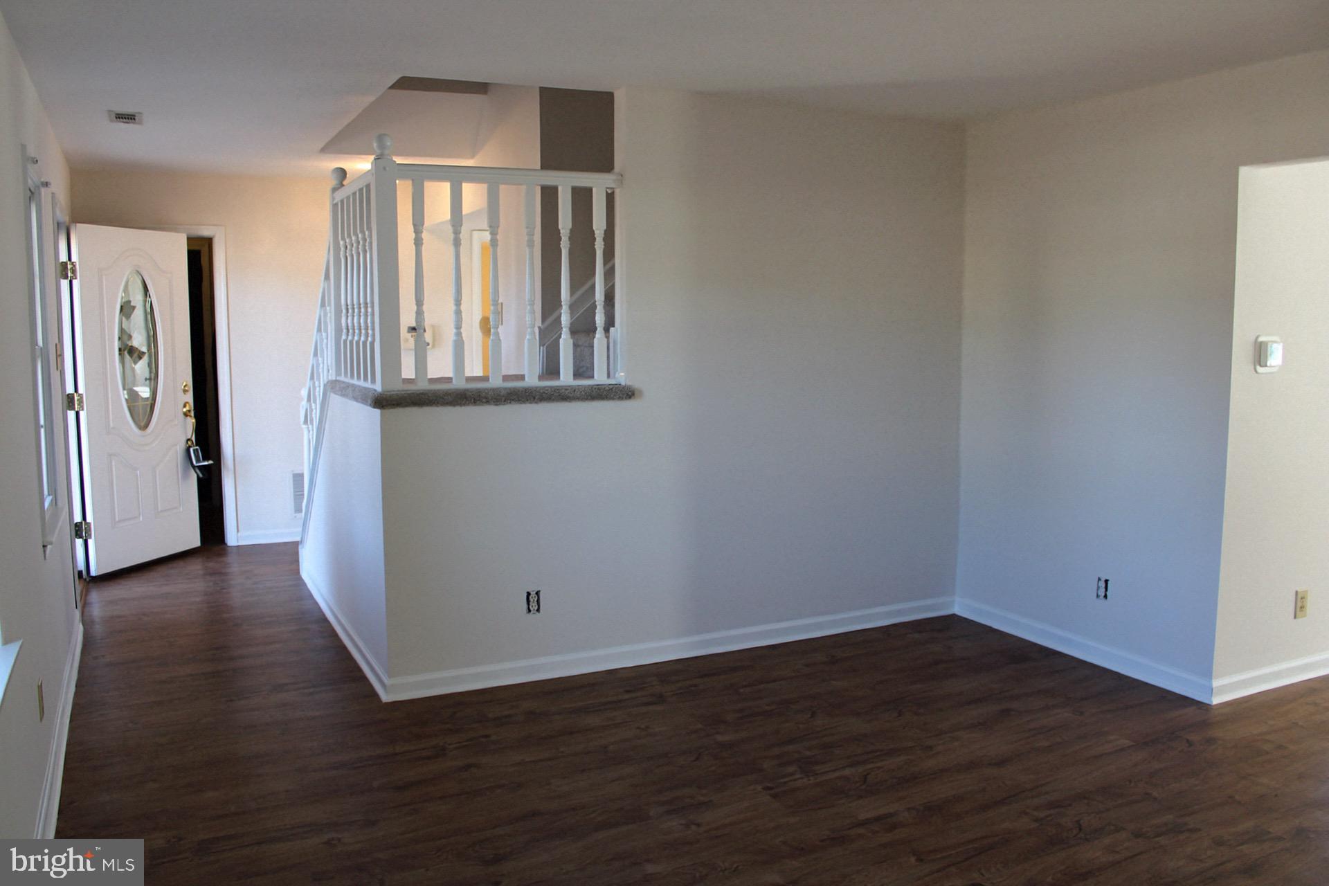 13 Langley Drive Sewell, NJ 08080 - Photo 6 of 31 an empty room with wooden floor and windows