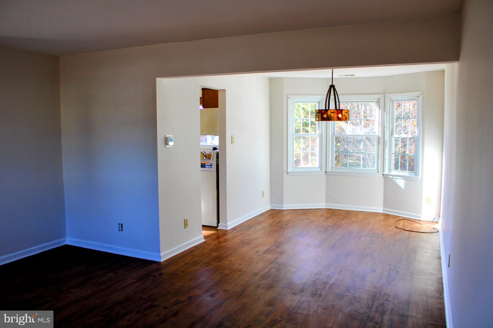 13 Langley Drive Sewell, NJ 08080 - Photo 7 of 31 a view of an empty room with window and wooden floor