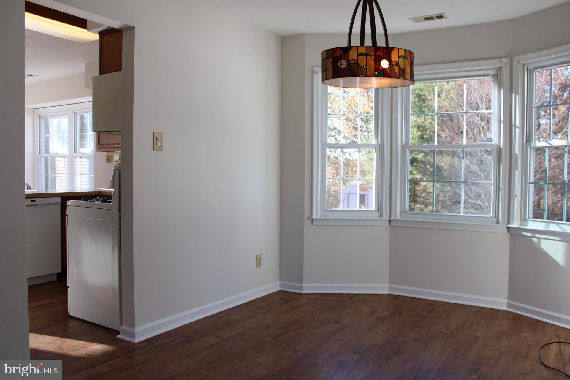 13 Langley Drive Sewell, NJ 08080 - Photo 9 of 31 an empty room with wooden floor and windows