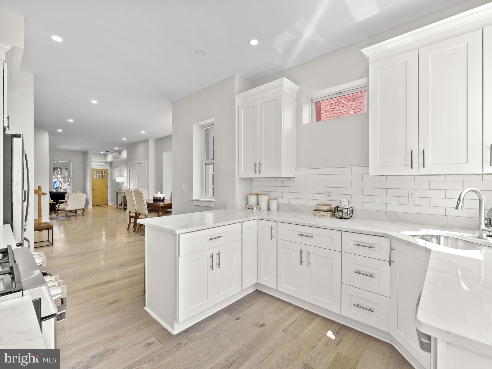 532 Shepherd Street Northwest Washington, DC 20011 - Photo 12 of 28 White Shaker Kitchen Cabinets with Quartz Counter