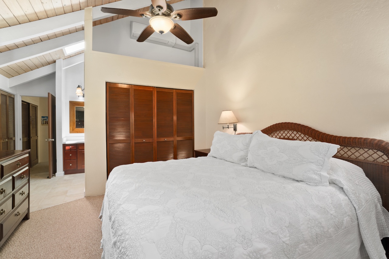 2330 Ho'ohu Road, Unit 27 Koloa, HI 96756 - Photo 15 of 30 a bedroom with a bed and a television