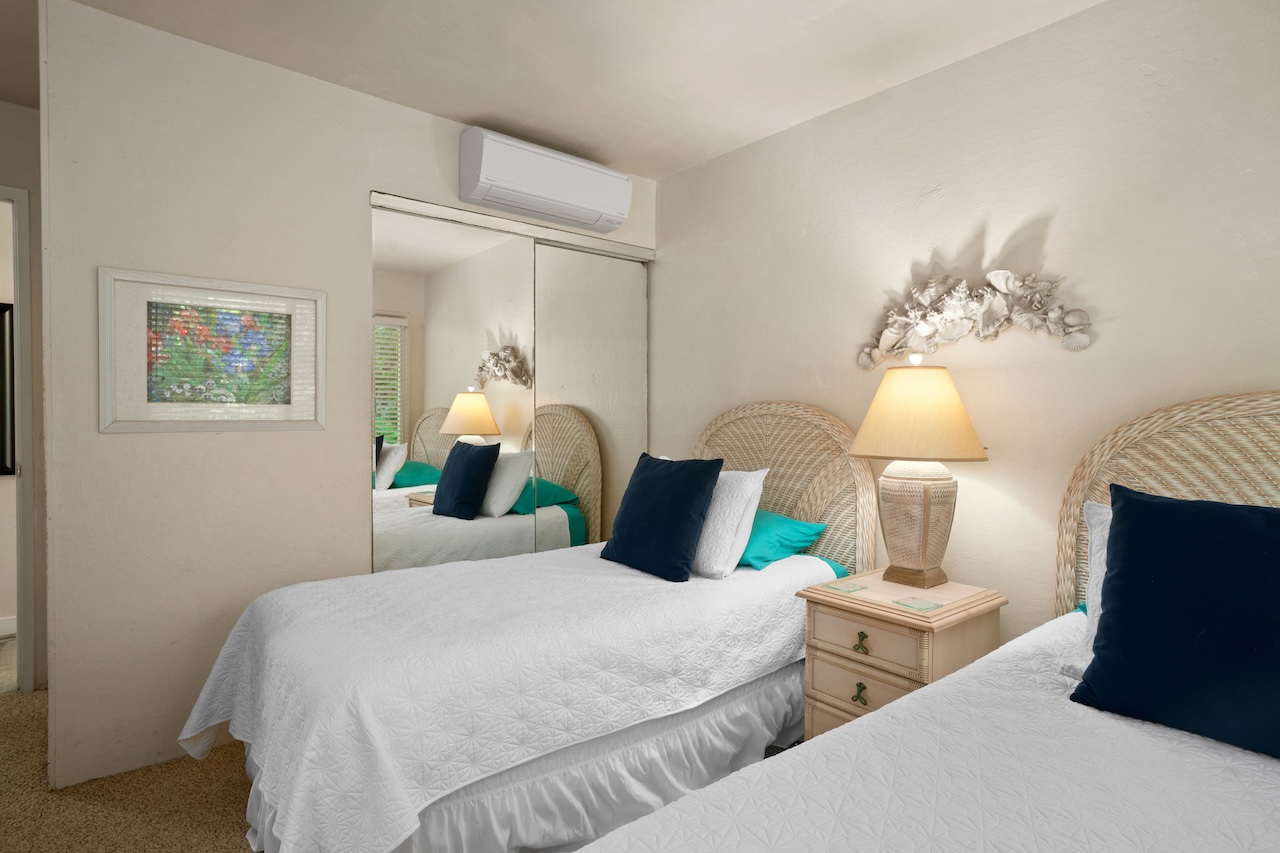 2330 Ho'ohu Road, Unit 27 Koloa, HI 96756 - Photo 19 of 30 a bedroom with two beds and lamps