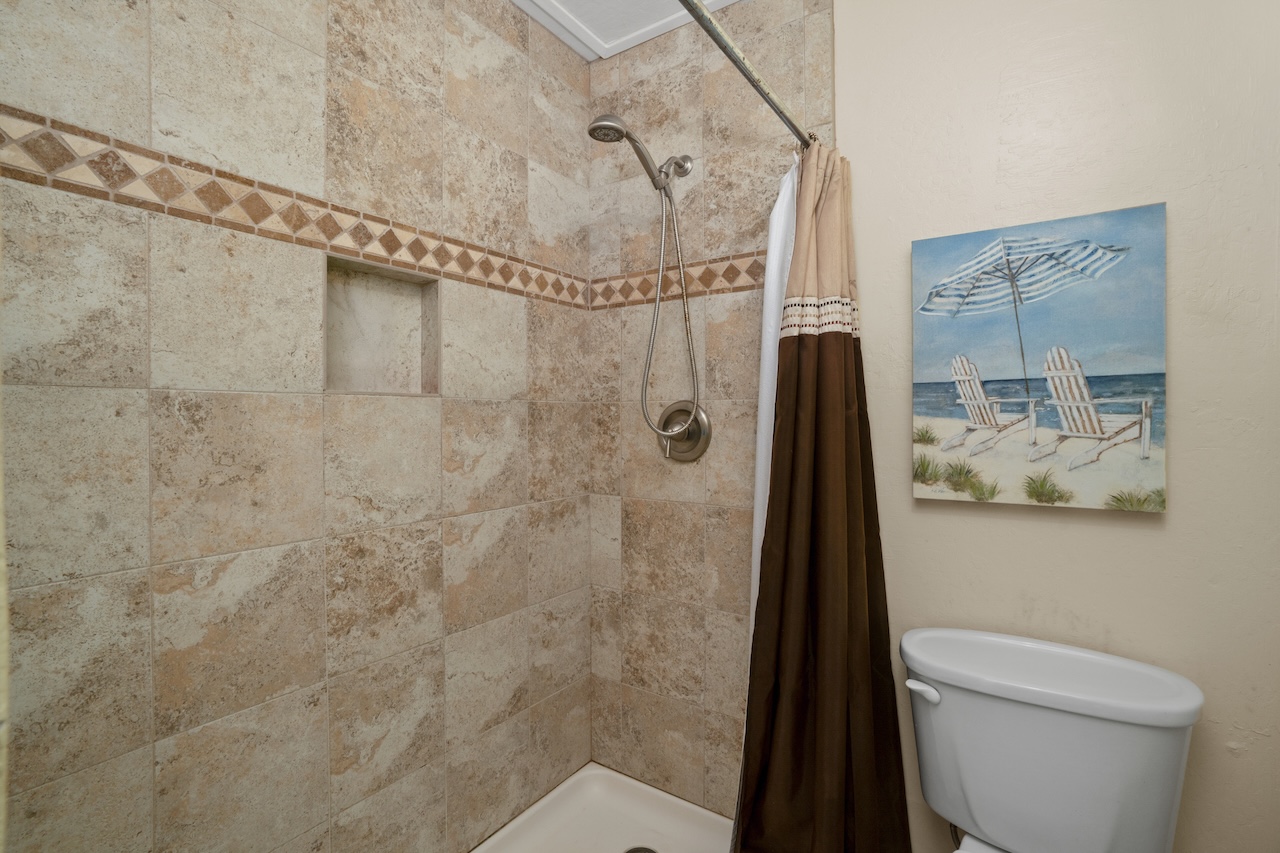2330 Ho'ohu Road, Unit 27 Koloa, HI 96756 - Photo 20 of 30 a bathroom with a shower a toilet and a shower