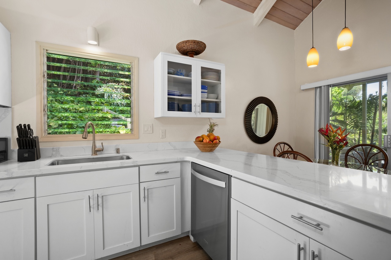 2330 Ho'ohu Road, Unit 27 Koloa, HI 96756 - Photo 10 of 30 a kitchen with a sink and a window