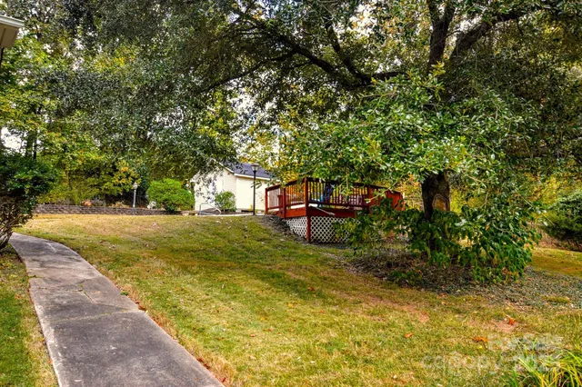 a view of backyard with swimming pool