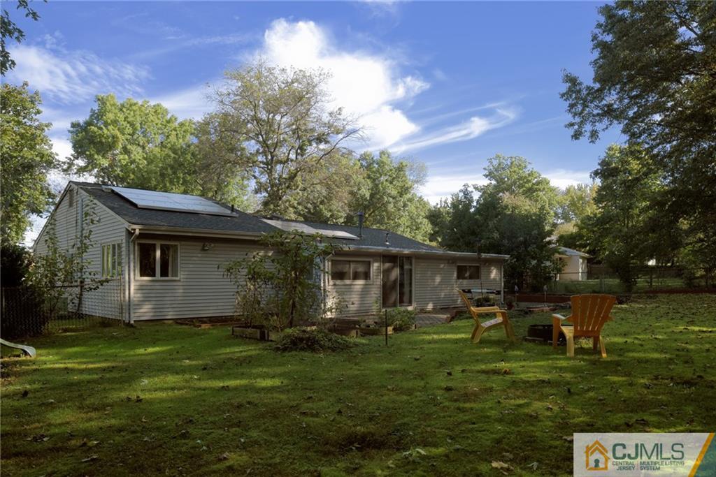 27 Springdale Road Kendall Park, NJ 08824 - Photo 22 of 25 a house view with a garden space