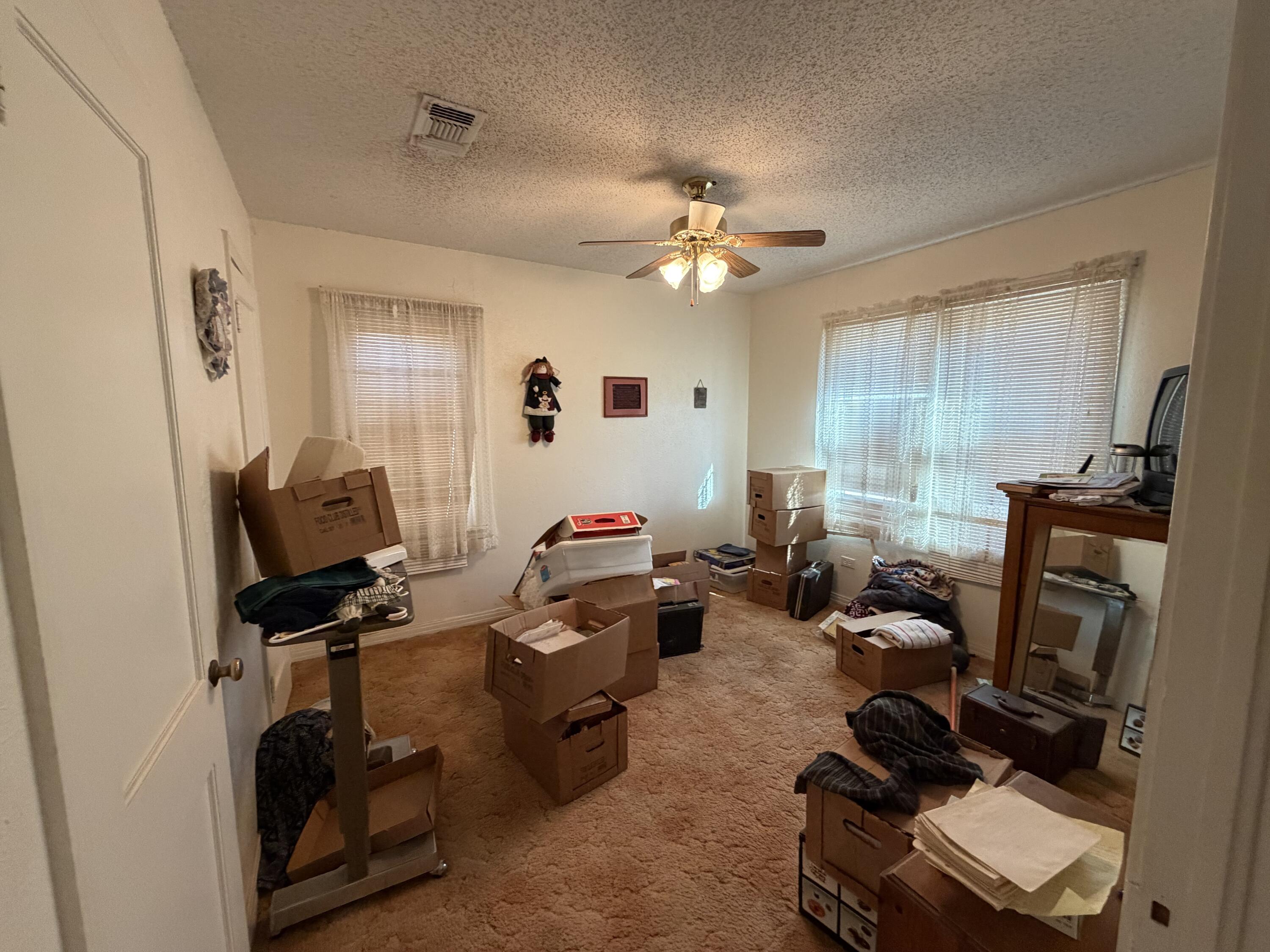 912 Bell Avenue Turkey, TX 79261 - Photo 8 of 12 a view of a workspace with furniture and a window