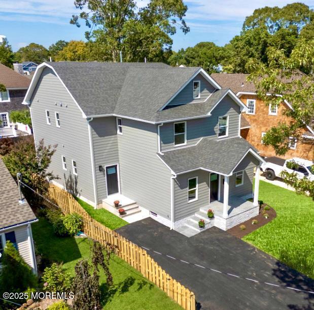 1413 George Street Point Pleasant, NJ 08742 - Photo 1 of 51 a front view of a house with a yard and garage