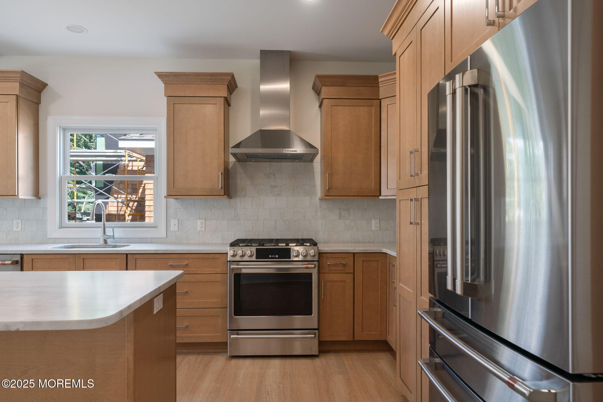 1413 George Street Point Pleasant, NJ 08742 - Photo 11 of 51 a kitchen with stainless steel appliances granite countertop a sink a stove and a refrigerator