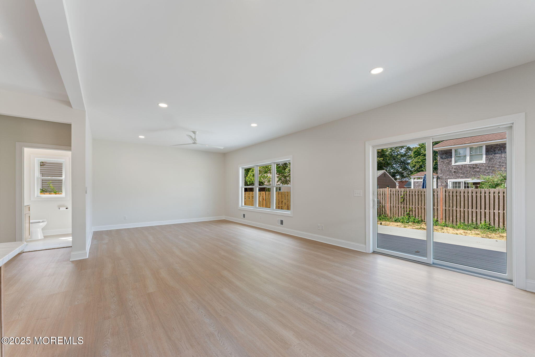 1413 George Street Point Pleasant, NJ 08742 - Photo 20 of 51 an empty room with wooden floor and windows