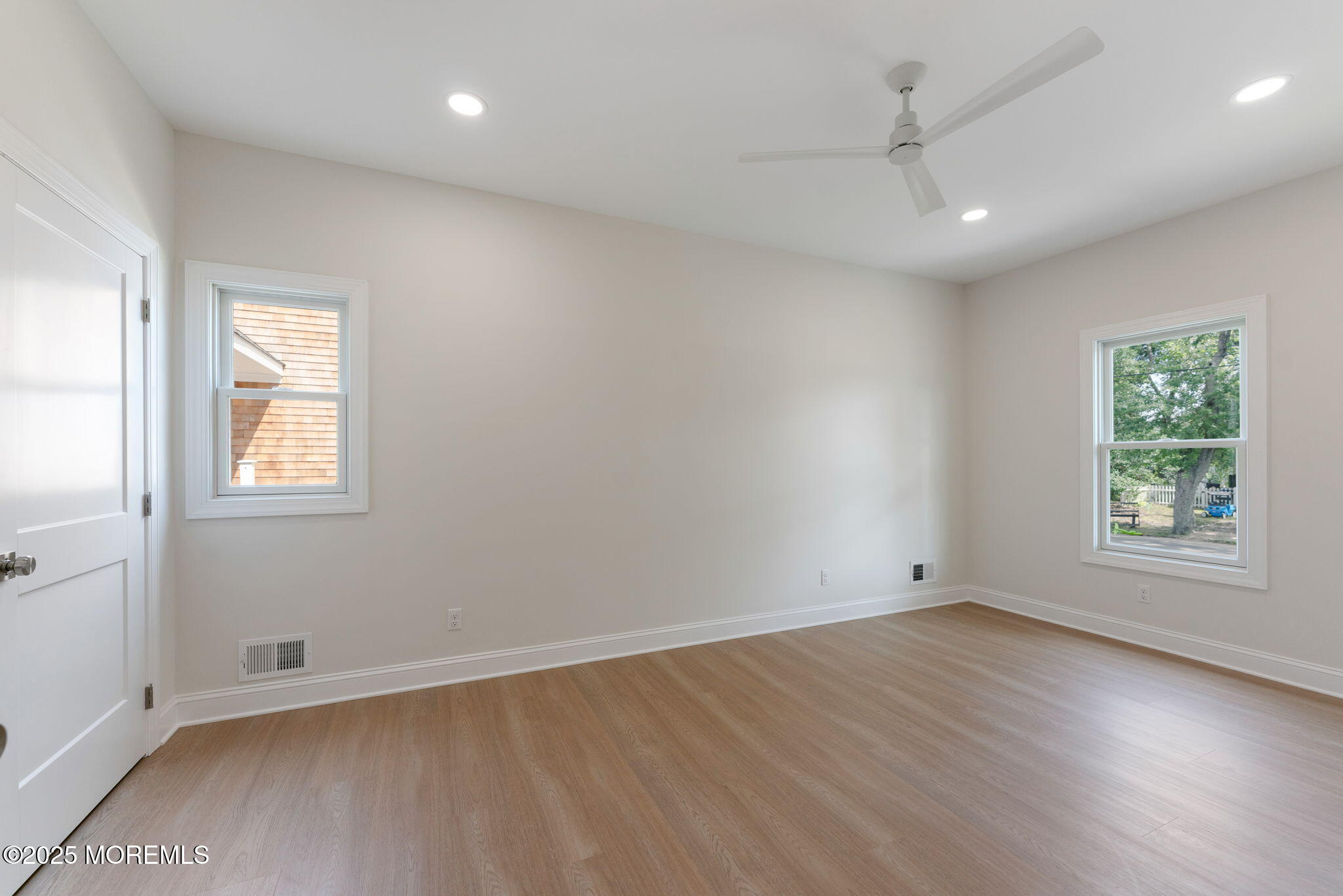 1413 George Street Point Pleasant, NJ 08742 - Photo 22 of 51 an empty room with wooden floor and windows