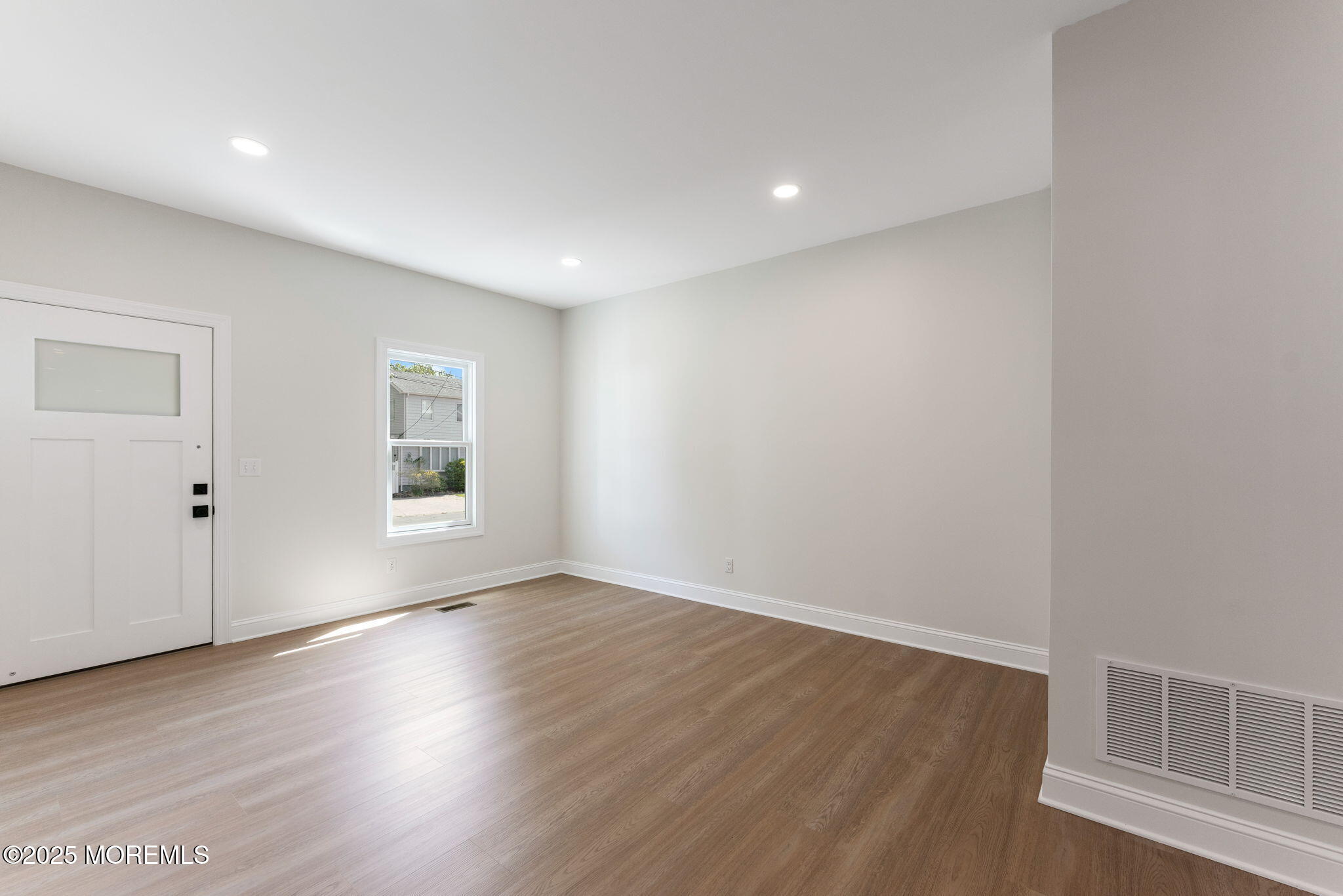 1413 George Street Point Pleasant, NJ 08742 - Photo 26 of 51 an empty room with wooden floor and windows