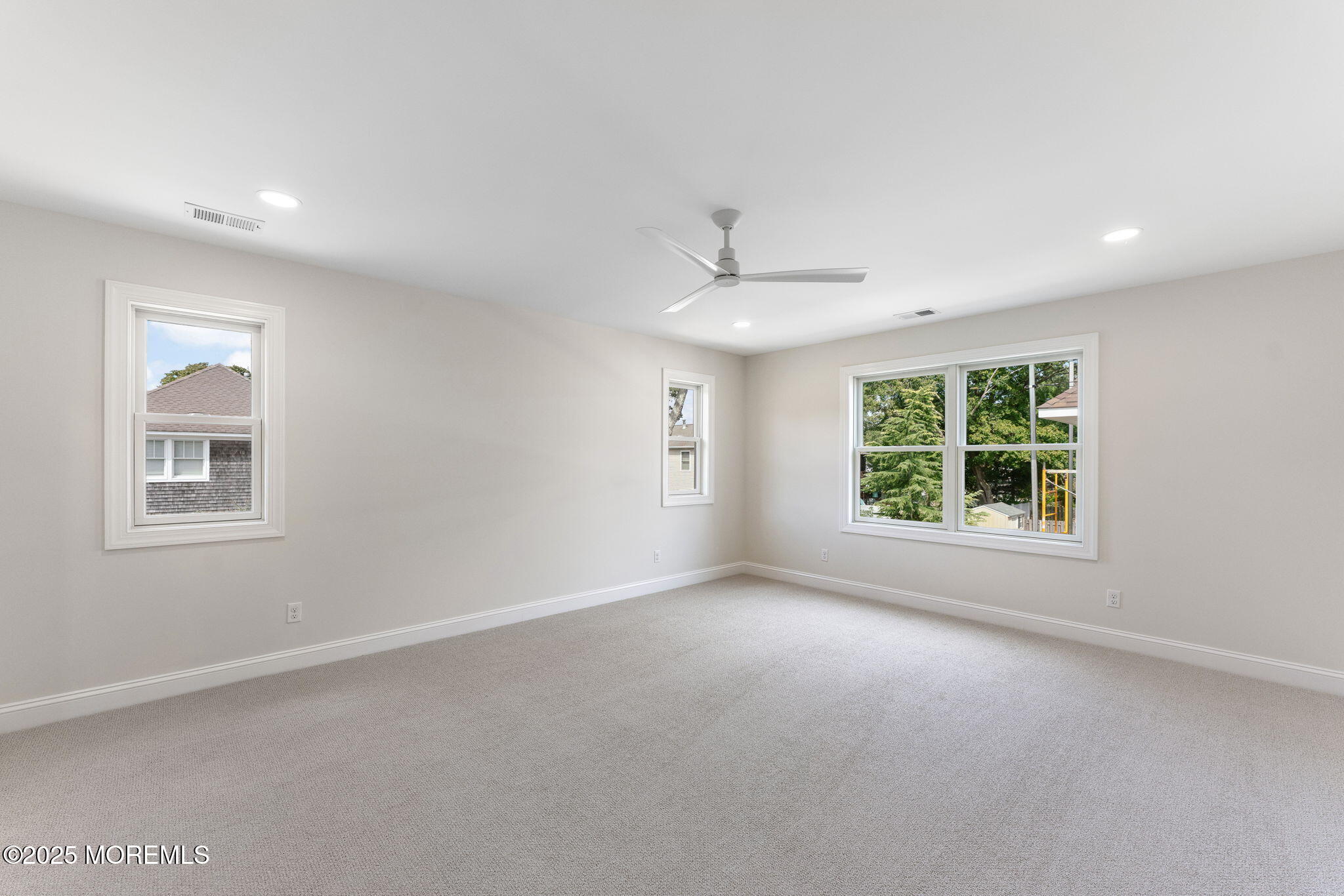 1413 George Street Point Pleasant, NJ 08742 - Photo 30 of 51 a view of a big room with windows and chandelier fan