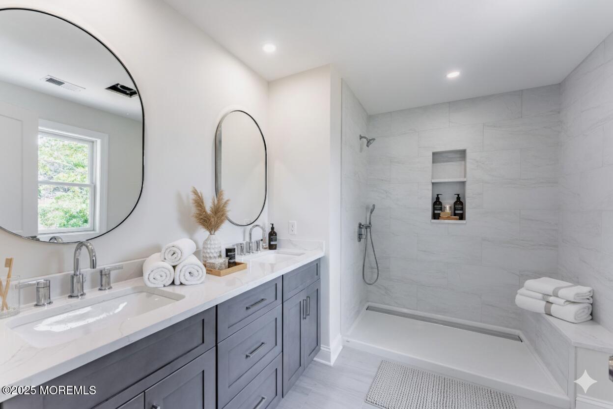 1413 George Street Point Pleasant, NJ 08742 - Photo 32 of 51 a bathroom with a double vanity sink mirror and shower