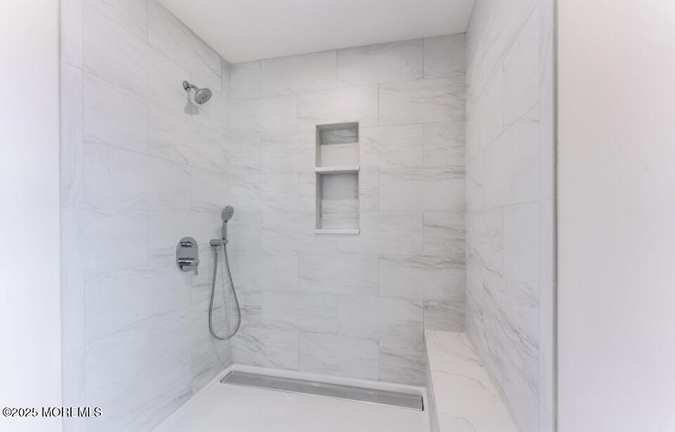 1413 George Street Point Pleasant, NJ 08742 - Photo 33 of 51 a bathroom with a glass shower door