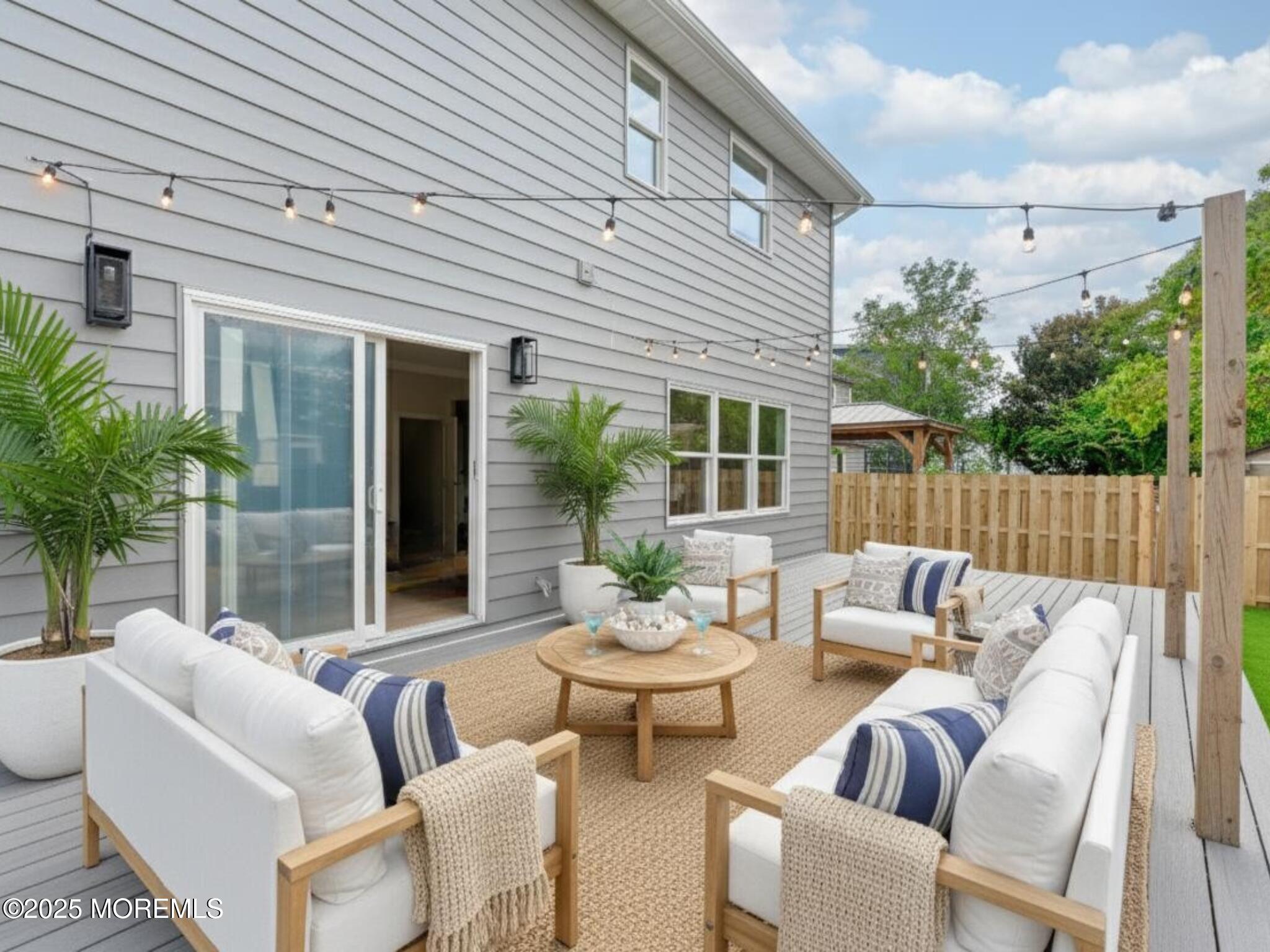 1413 George Street Point Pleasant, NJ 08742 - Photo 46 of 51 a view of a patio with couches chairs and a potted plant