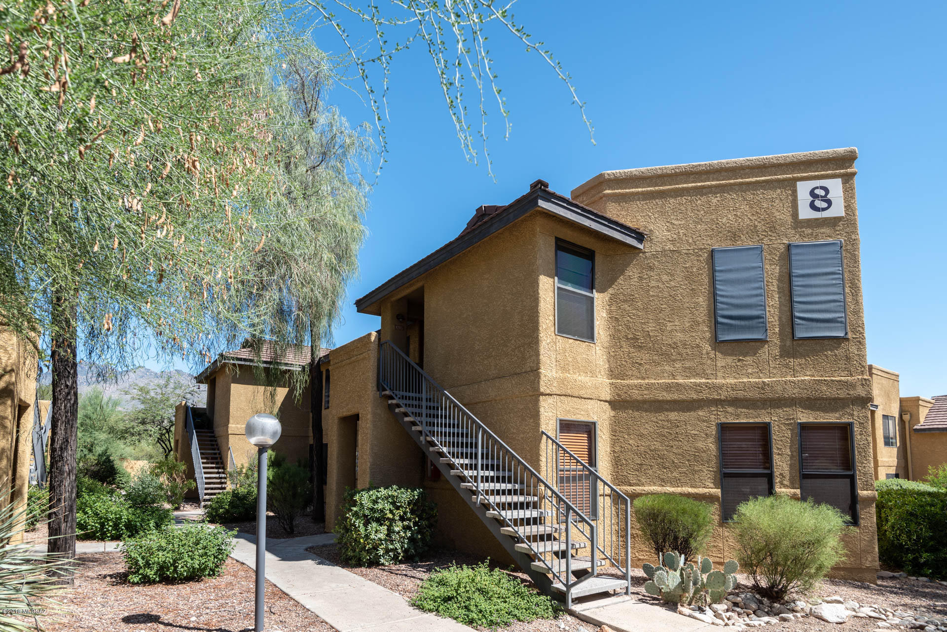7255 East Snyder Road, Unit 8205 Tucson, AZ 85750 - Photo 16 of 23 a front view of a house with garden