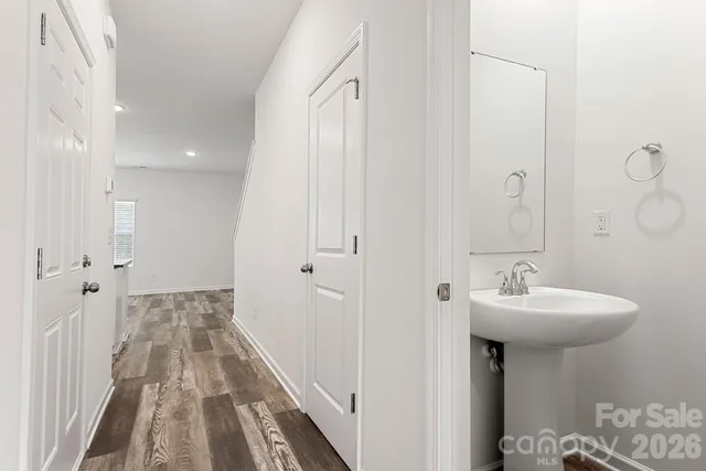 a bathroom with a sink a mirror and a shower