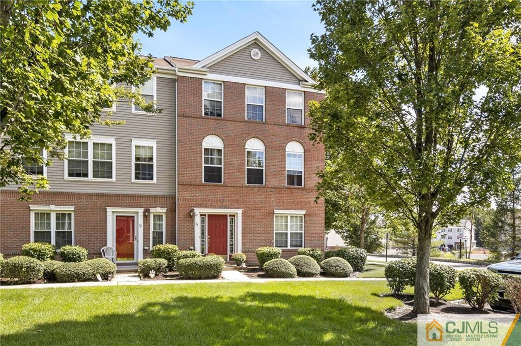 35 Rojewski Way Sayreville, NJ 08859 - Photo 1 of 23 a front view of a house with garden