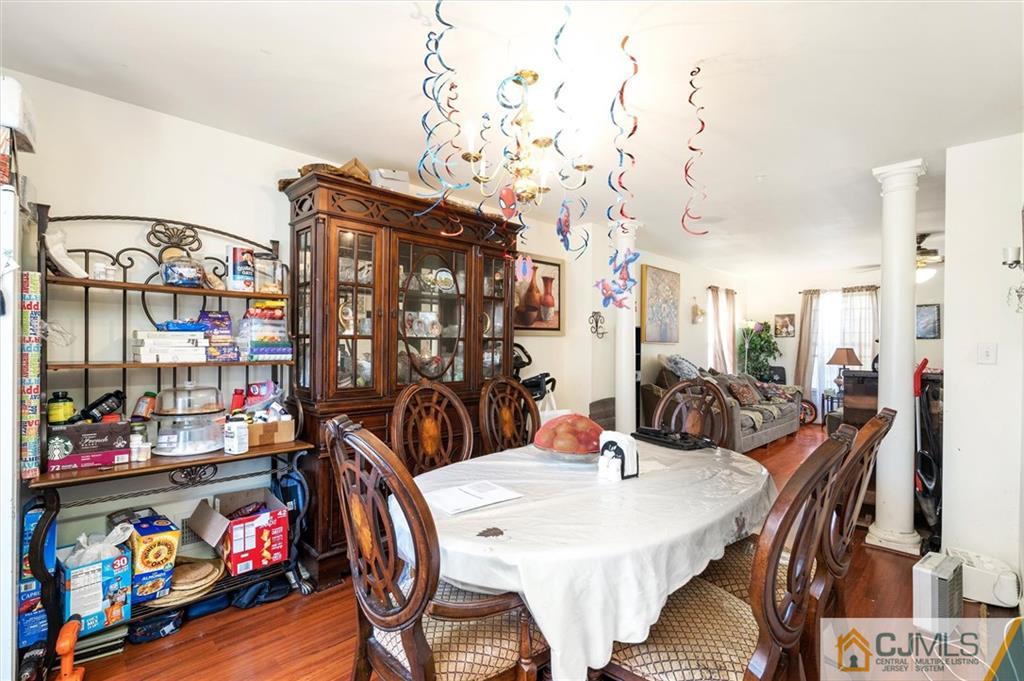 35 Rojewski Way Sayreville, NJ 08859 - Photo 12 of 23 a view of a dining room with furniture and a chandelier