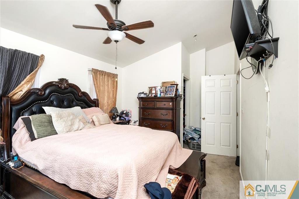 35 Rojewski Way Sayreville, NJ 08859 - Photo 15 of 23 a bedroom with a bed and dresser