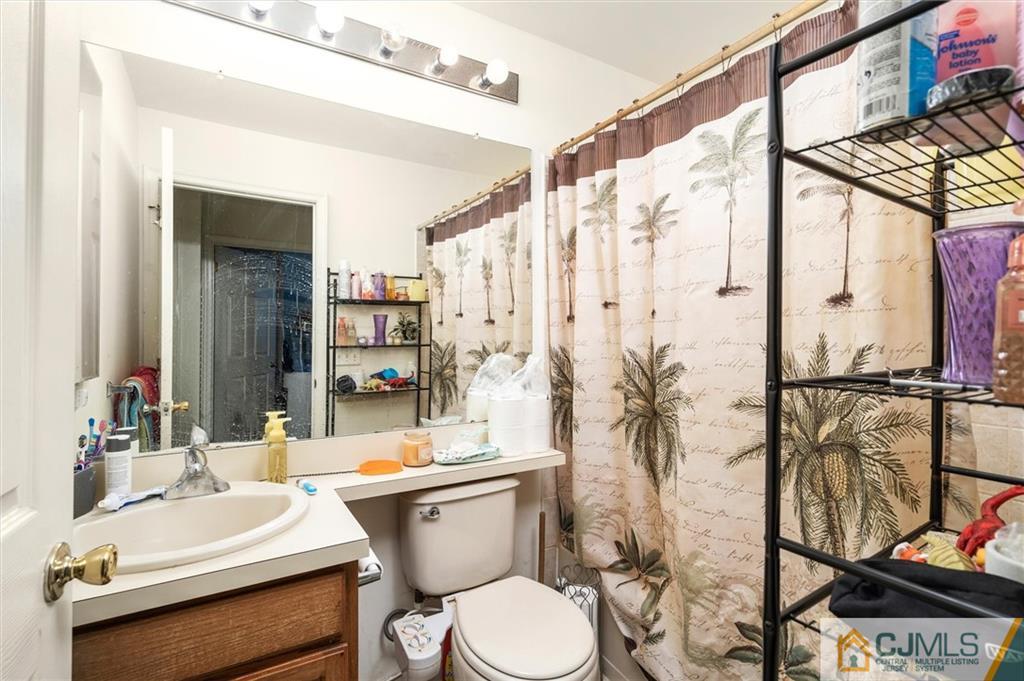 35 Rojewski Way Sayreville, NJ 08859 - Photo 17 of 23 a bathroom with a sink a toilet and shower