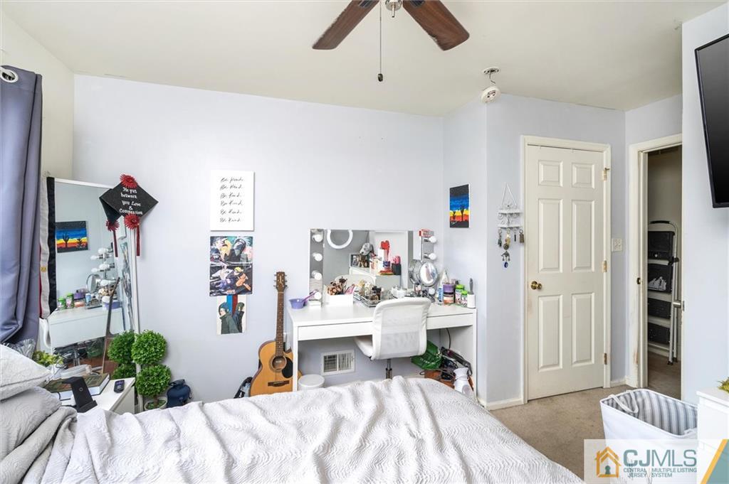 35 Rojewski Way Sayreville, NJ 08859 - Photo 20 of 23 a bedroom with a bed and a couch